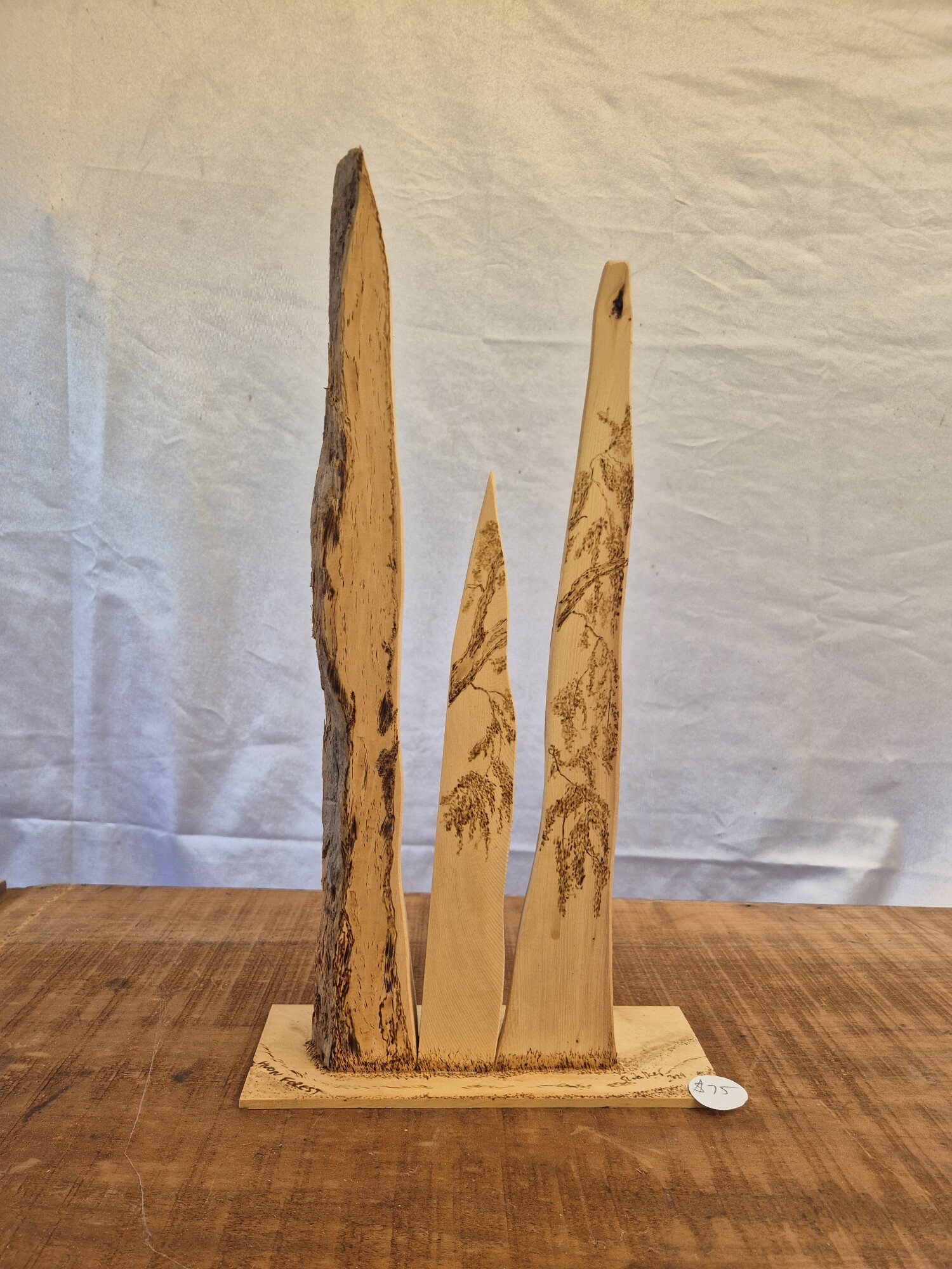 Standing representation of a Huon Pine forest. Pyrography on Huon Pine